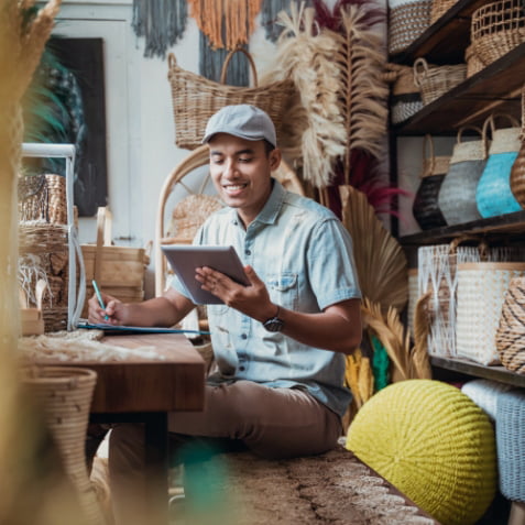 A man using an iPad on his office