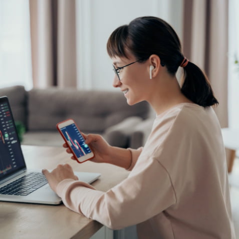 A woman working on her investments online